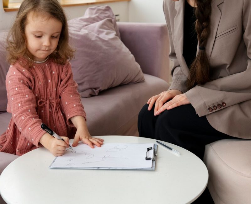 child-doing-therapy-session-with-psychologist_23-2149305201
